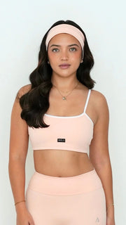 light pale baby pink white activewear matching set crop top spaghetti strap sleeveless contrast trim round neck headband high waisted flare leggings stretchy pilates yoga tennis golf strength training everyday soft freedom light support gym clothes athleisure workout inala quito ecuador slow fashion international global handmade sustainable