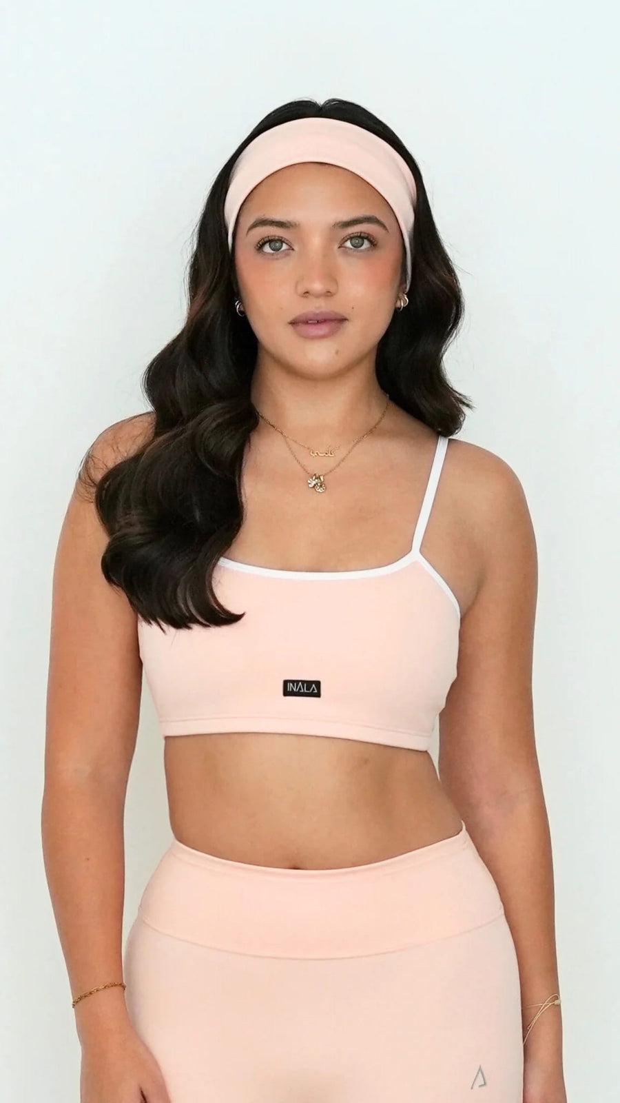 light pale baby pink white activewear matching set crop top spaghetti strap sleeveless contrast trim round neck headband high waisted flare leggings stretchy pilates yoga tennis golf strength training everyday soft freedom light support gym clothes athleisure workout inala quito ecuador slow fashion international global handmade sustainable