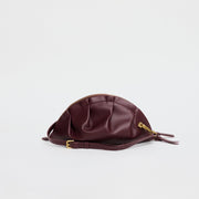 medium gyoza bag burgundy purse handbag crossbody shoulder maroon gold hardware adjustable strap leather zipper madrid spain international fashion imported independent designer slow fashion brand