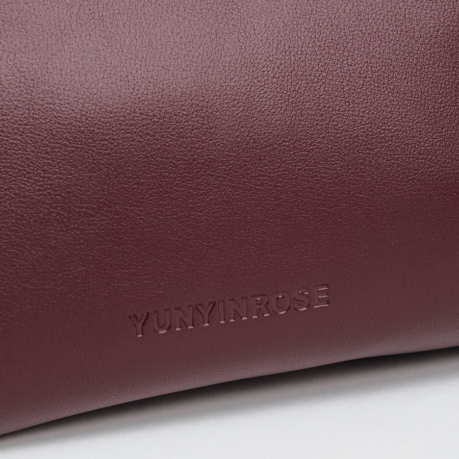 medium gyoza bag burgundy purse handbag crossbody shoulder maroon gold hardware adjustable strap leather zipper madrid spain international fashion imported independent designer slow fashion brand