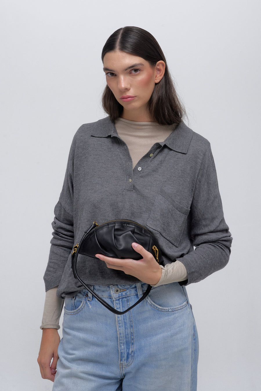 mini gyoza bag black purse handbag crossbody shoulder convertible gold hardware short strap adjustable long strap leather zipper madrid spain international fashion imported independent designer slow fashion brand