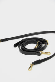 mini gyoza bag black purse handbag crossbody shoulder convertible gold hardware short strap adjustable long strap leather zipper madrid spain international fashion imported independent designer slow fashion brand