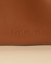 mini gyoza bag brown caramel purse handbag crossbody shoulder tan gold hardware wrist strap adjustable long strap leather zipper madrid spain international fashion imported independent designer slow fashion brand