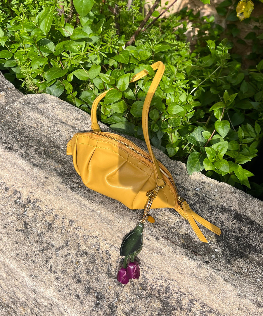mini gyoza bag mustard yellow purse handbag crossbody shoulder convertible gold hardware short strap adjustable long strap leather zipper madrid spain international fashion imported independent designer slow fashion brand