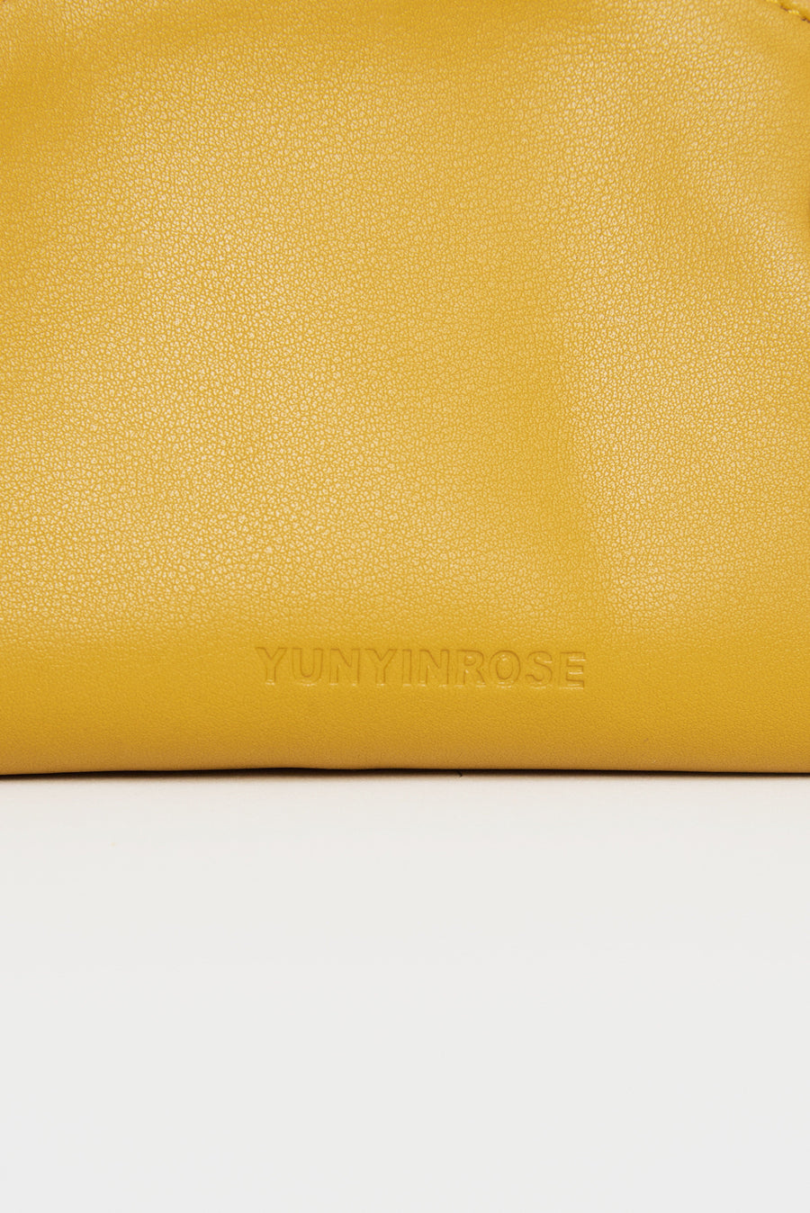 mini gyoza bag mustard yellow purse handbag crossbody shoulder convertible gold hardware short strap adjustable long strap leather zipper madrid spain international fashion imported independent designer slow fashion brand