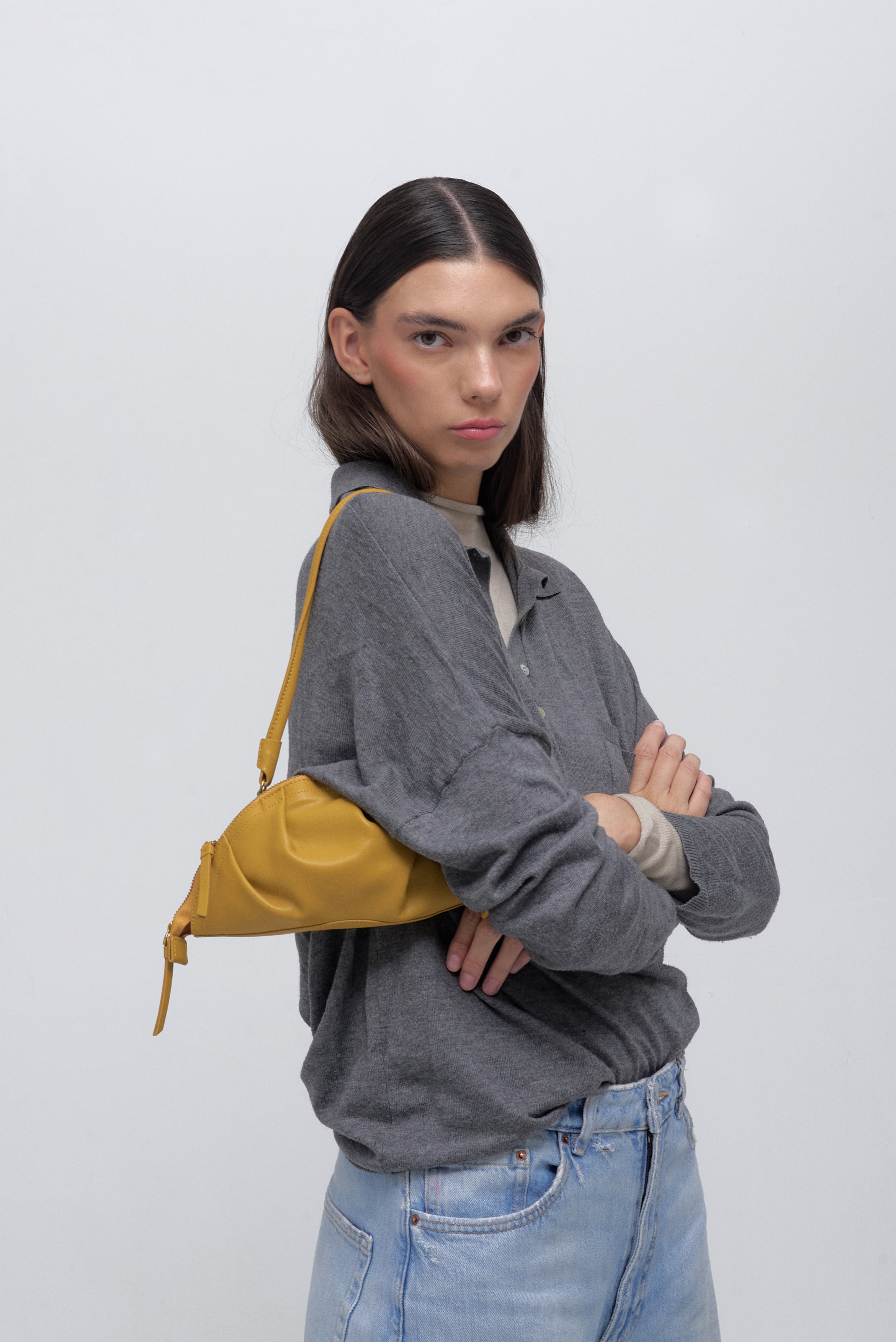 mini gyoza bag mustard yellow purse handbag crossbody shoulder convertible gold hardware short strap adjustable long strap leather zipper madrid spain international fashion imported independent designer slow fashion brand