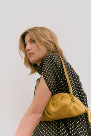 mini gyoza bag mustard yellow purse handbag crossbody shoulder convertible gold hardware short strap adjustable long strap leather zipper madrid spain international fashion imported independent designer slow fashion brand