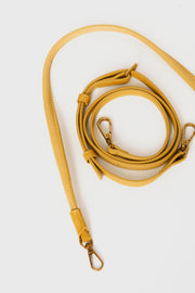 mini gyoza bag mustard yellow purse handbag crossbody shoulder convertible gold hardware short strap adjustable long strap leather zipper madrid spain international fashion imported independent designer slow fashion brand