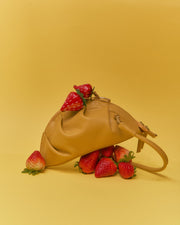 mini gyoza bag mustard yellow purse handbag crossbody shoulder convertible gold hardware short strap adjustable long strap leather zipper madrid spain international fashion imported independent designer slow fashion brand