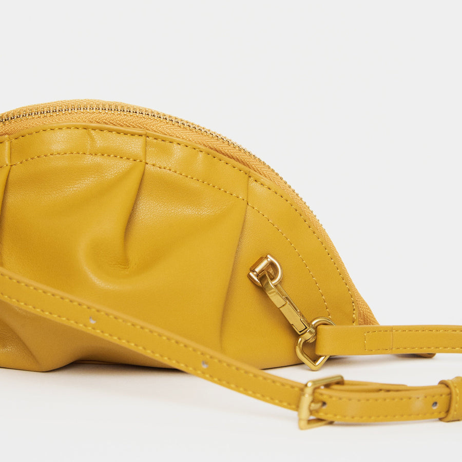 mini gyoza bag mustard yellow purse handbag crossbody shoulder convertible gold hardware short strap adjustable long strap leather zipper madrid spain international fashion imported independent designer slow fashion brand