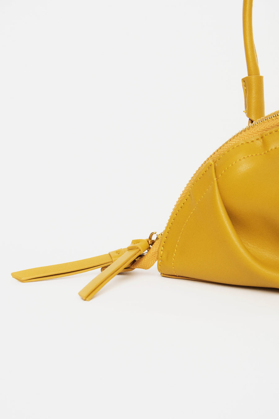 mini gyoza bag mustard yellow purse handbag crossbody shoulder convertible gold hardware short strap adjustable long strap leather zipper madrid spain international fashion imported independent designer slow fashion brand