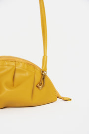 mini gyoza bag mustard yellow purse handbag crossbody shoulder convertible gold hardware short strap adjustable long strap leather zipper madrid spain international fashion imported independent designer slow fashion brand