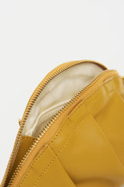 mini gyoza bag mustard yellow purse handbag crossbody shoulder convertible gold hardware short strap adjustable long strap leather zipper madrid spain international fashion imported independent designer slow fashion brand