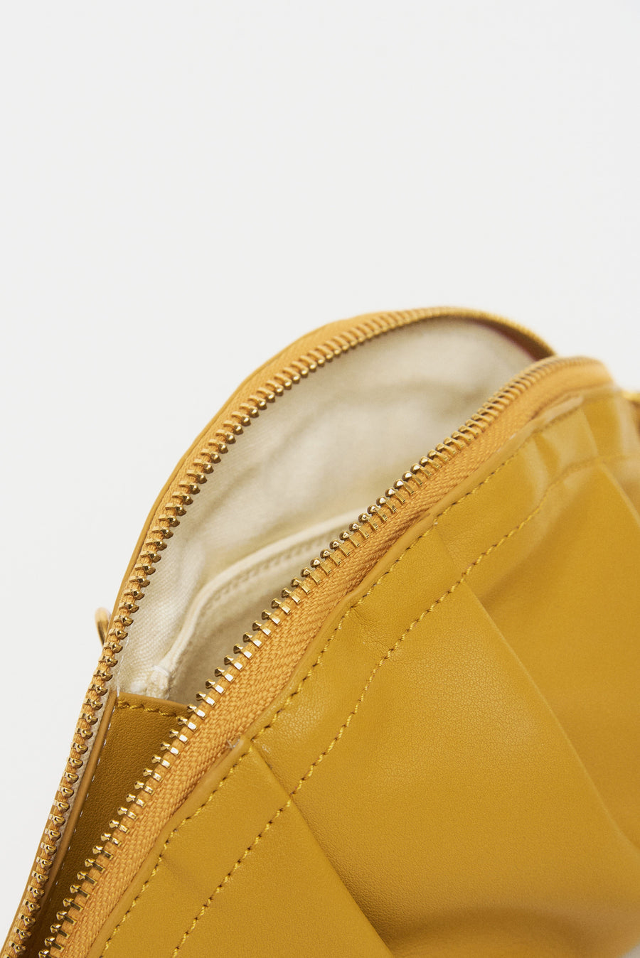 mini gyoza bag mustard yellow purse handbag crossbody shoulder convertible gold hardware short strap adjustable long strap leather zipper madrid spain international fashion imported independent designer slow fashion brand