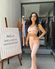 light pale baby pink white activewear matching set crop top spaghetti strap sleeveless contrast trim round neck high waisted flare leggings stretchy pilates yoga tennis golf strength training everyday soft freedom light support gym clothes athleisure workout inala quito ecuador slow fashion international global handmade sustainable