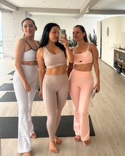 light pale baby pink white activewear matching set crop top spaghetti strap sleeveless contrast trim round neck high waisted flare leggings stretchy pilates yoga tennis golf strength training everyday soft freedom light support gym clothes athleisure workout inala quito ecuador slow fashion international global handmade sustainable